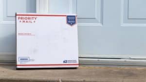 image showing a usps box against a door - header for usps shipping weight cost